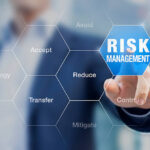 Businessman pointing at risk management concept on screen